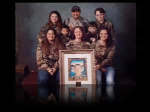 Comer family with Tyler's portrait